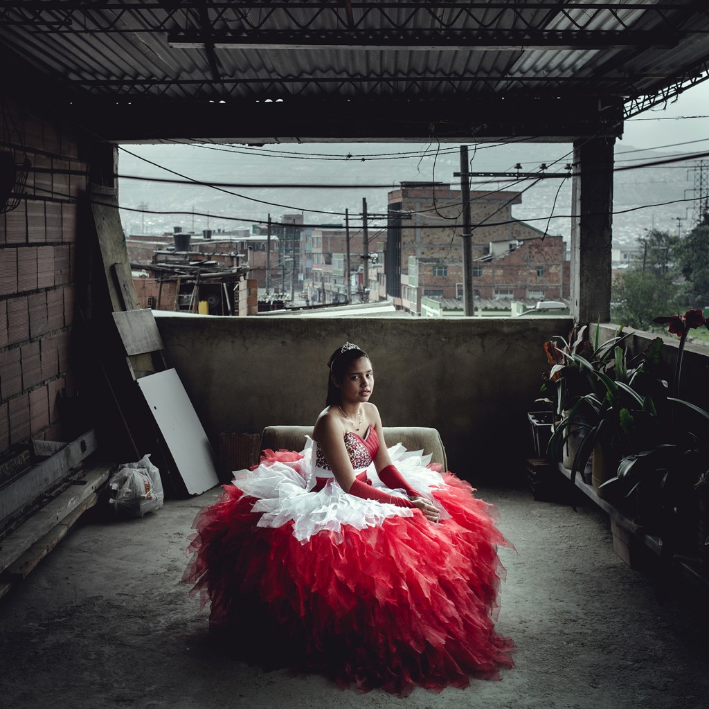 Laura Cristina Zarta poses in her Quinceanera Dress, at her parents' home in the southern suburb of Bogotá